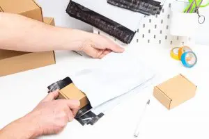 Person packs polymailer bubble packaging