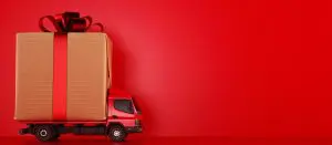 Big holiday or Christmas gift package on a red truck ready to be delivered