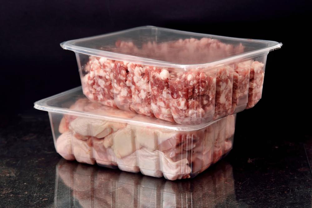 Clear plastic clamshell containers with meat inside