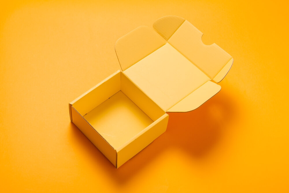 yellow cardboard box on a yellow background