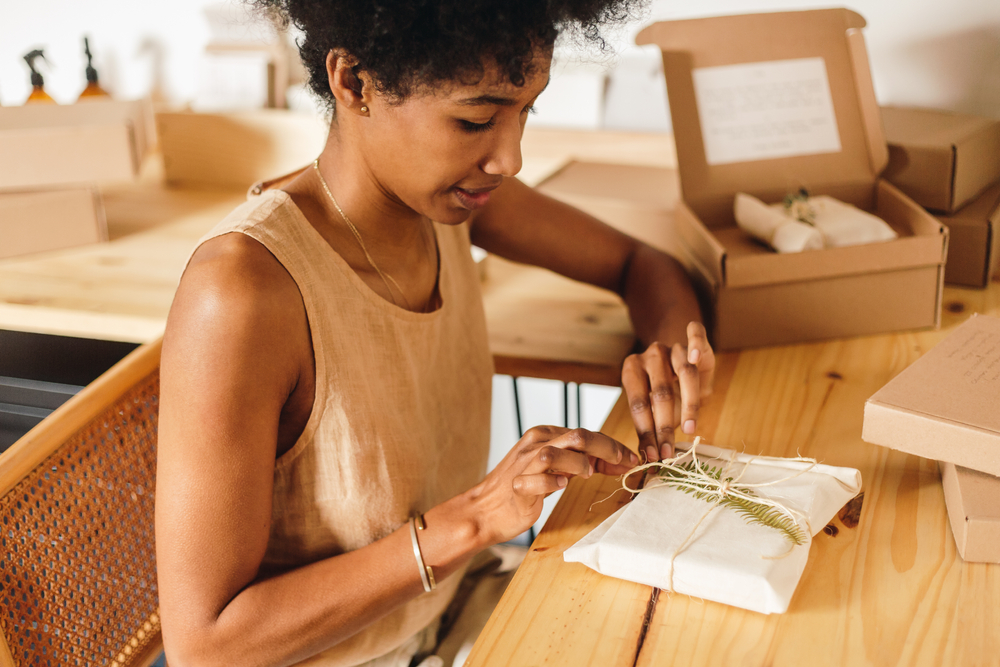 Woman opening a gift with accessible packaging