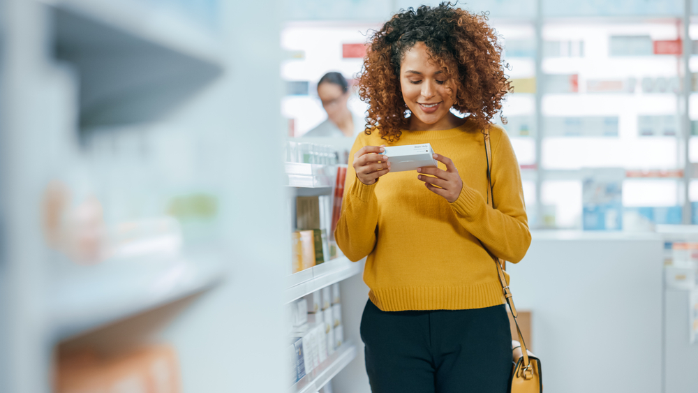 Customer reading cosmetics packaging in the store